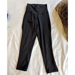 Black high waisted cropped leggings with mesh side